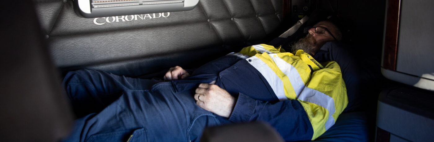 Man laying awake in truck cab